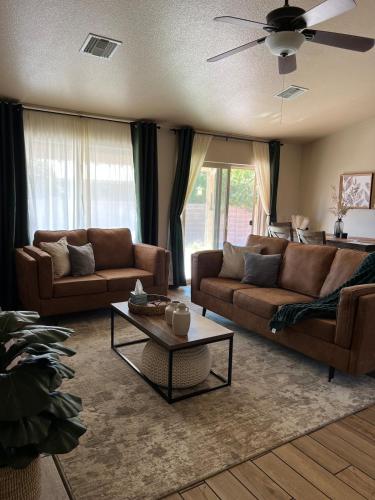 a living room with two couches and a coffee table at Our Cozy Home Fully Equipped in Yuma