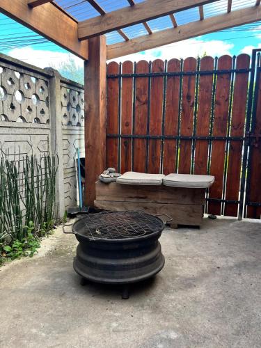 a tire sitting in front of a wooden fence at Cabaña Andrea in Curacautín