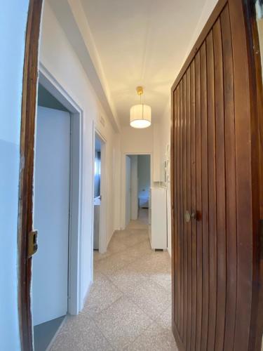 a hallway with a wooden door in a room at Residenza Minori in Minori