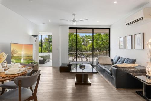 a living room with a couch and a table at Perfect Spot Near CBD n UQ Spacious 2Beds Apt in Brisbane