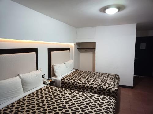 Кровать или кровати в номере Hotel Essen's