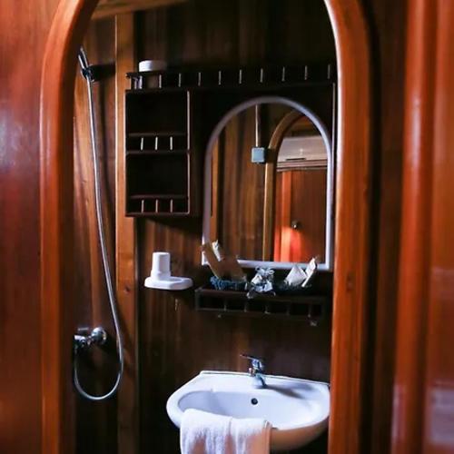 a bathroom with a sink and a mirror at Il Caicco B&B in Rodi Garganico