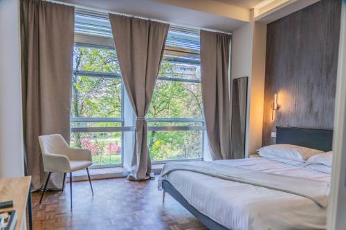 Postel nebo postele na pokoji v ubytování Giardini Rooms
