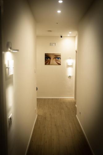 an empty hallway with a painting on the wall at Chez Nunù in Ercolano