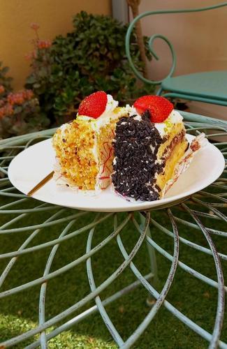 two pieces of cake on a plate on a table at Bed and Breakfast Rosangela in Taormina