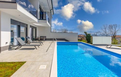 a swimming pool in the backyard of a house at Villa Agata in Lovran