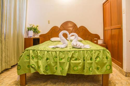En eller flere senger på et rom på Hotel Sol del Oriente Iquitos