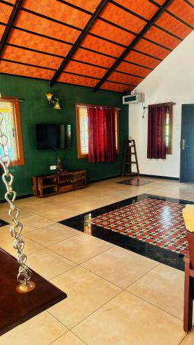 a dance floor with a chain in a room at Wood House Near Isha And Karunya University by Shivalaya in Alāndurai