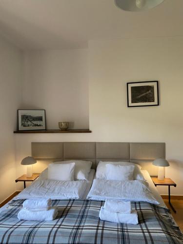 a bedroom with a bed with two pillows on it at Centrum Łąkowa 1 in Wünschelburg