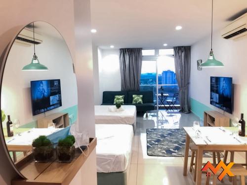 a living room with a mirror and a couch at KSL City Mall 6-20pax Private Lift-Netflix-SmartTV 70inch in Johor Bahru