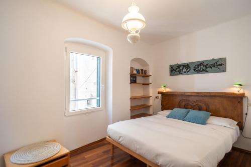 Ένα ή περισσότερα κρεβάτια σε δωμάτιο στο Casa Del Subacqueo. Amazing Terrace With Sea View. Wi-Fi