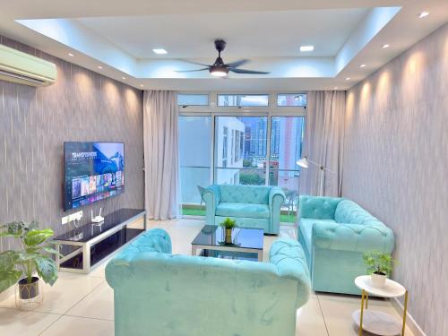 a living room with blue chairs and a tv at KSL City Mall 6-20pax Private Lift-Netflix-SmartTV 70inch in Johor Bahru