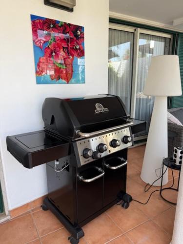 a kitchen with a grill and a stove with a lamp at Vila Sol, Apartment 468 in Quarteira