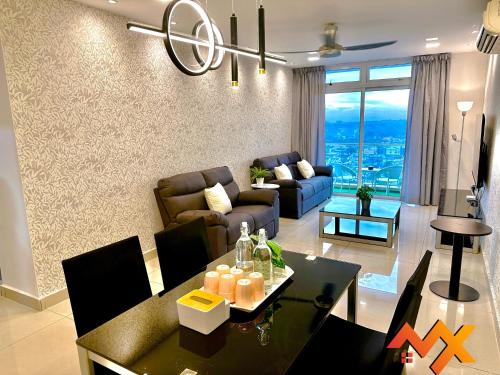 a living room with a couch and a table at KSL City Mall 6-20pax Private Lift-Netflix-SmartTV 70inch in Johor Bahru