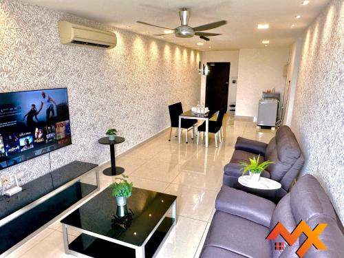 a living room with a couch and a tv at KSL City Mall 6-20pax Private Lift-Netflix-SmartTV 70inch in Johor Bahru