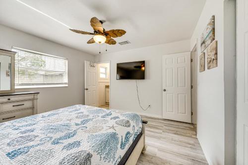 a bedroom with a bed and a ceiling fan at Less Than 2 Mi to Beach and Marina Bright Ruskin Retreat! in Ruskin