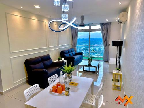 a living room with a couch and a table at KSL City Mall 6-20pax Private Lift-Netflix-SmartTV 70inch in Johor Bahru