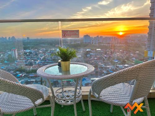 a table with two chairs and a view of a city at KSL City Mall 6-20pax Private Lift-Netflix-SmartTV 70inch in Johor Bahru