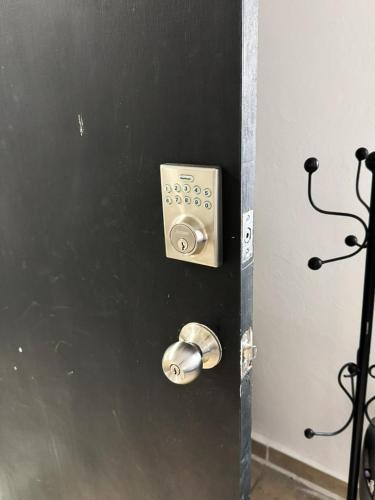 a black door with a door knob and a metal door sidx sidx at Comfortable and Centrally Located Accommodation in Altamira