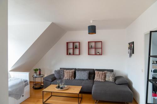 a living room with a couch and a table at BRIGHT by Interior Apartments in Kassel