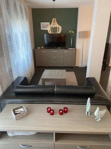 a living room with a couch and a table at Housing De Brouwerij in Westdorpe
