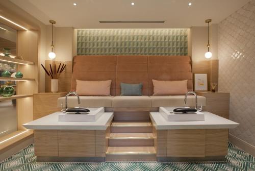 a bathroom with two sinks in a room at Mottram Hall in Macclesfield