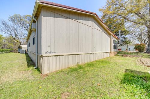 a large white building with a grass yard at Walk to Beach Eufaula Fishermans Delight Home in Eufaula