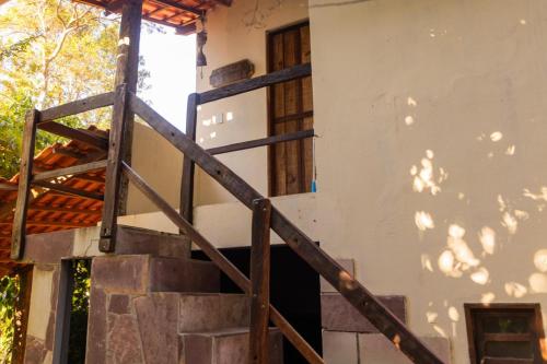 a wooden staircase leading up to a building at Recanto Pitanga in Vale do Capao
