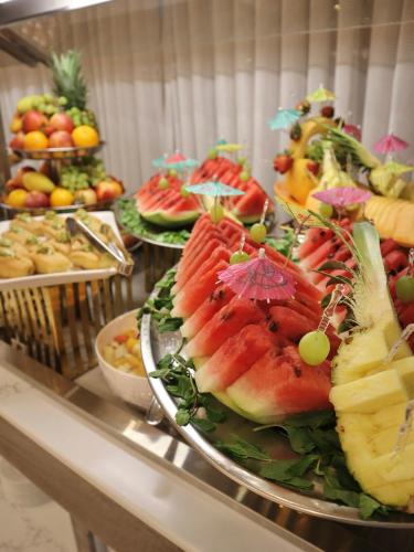 a buffet with a bunch of fruit on a table at Odest in Al Madinah