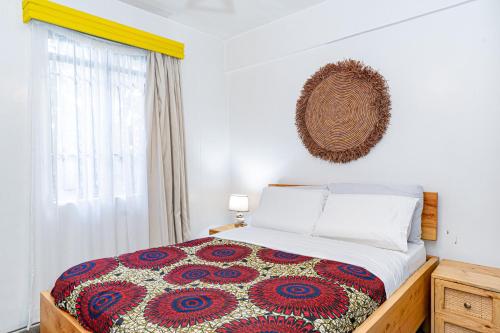 Ένα ή περισσότερα κρεβάτια σε δωμάτιο στο Kazuri Apartment in Westlands close proximity to Aga Hhan
