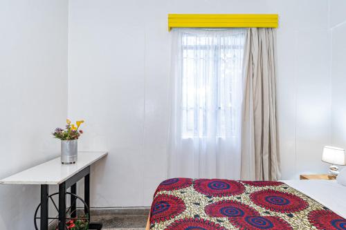 Ένα ή περισσότερα κρεβάτια σε δωμάτιο στο Kazuri Apartment in Westlands close proximity to Aga Hhan