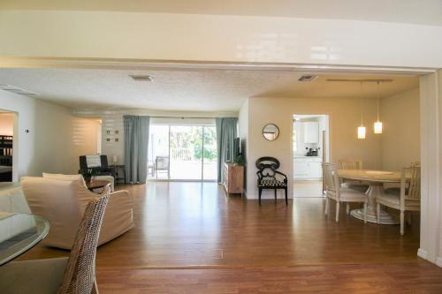 a living room with a couch and a table at Beautiful 3 BR pool home minutes from Siesta Key - Blue Dolphin in Sarasota