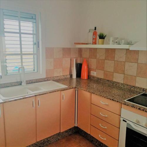 a kitchen with a sink and a counter top at Mara´s House, oasis de paz in Nazaret