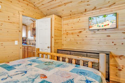 a bedroom with a bed in a cabin at Good Times Motel and Marina in Steinhatchee