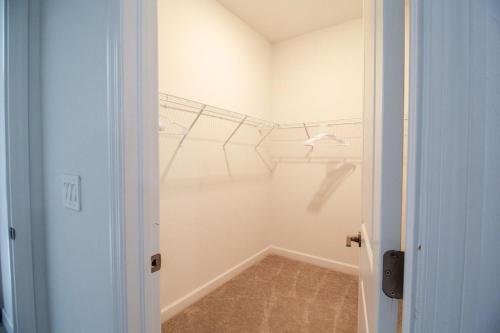 an empty room with a hallway with a hallway at Serene lakefront pool home in Lorraine Lakes - Coral Paradise in Bradenton