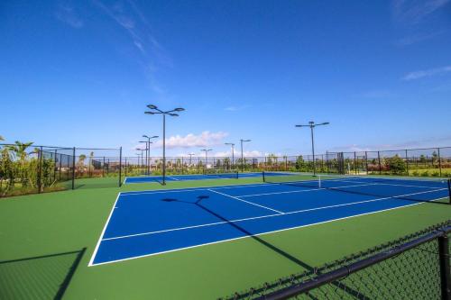 a tennis court with two tennis courts at Serene lakefront pool home in Lorraine Lakes - Coral Paradise in Bradenton