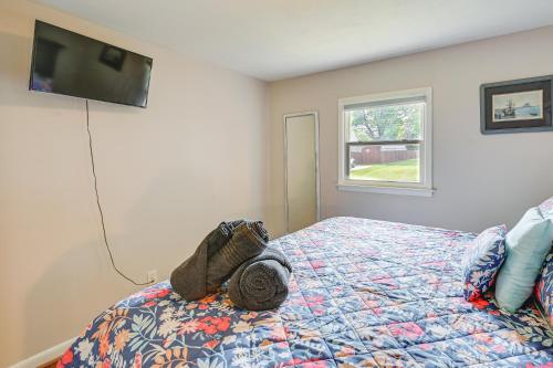 a bedroom with a bed with a towel on it at Greensboro Vacation Rental 2 Mi to Downtown! in Greensboro