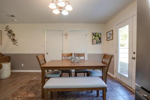 a dining room with a wooden table and chairs at Decatur Vacation Rental Retreat with Private Yard! in Decatur