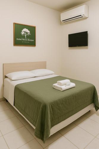 Ένα ή περισσότερα κρεβάτια σε δωμάτιο στο Hotel Nosso Bosque