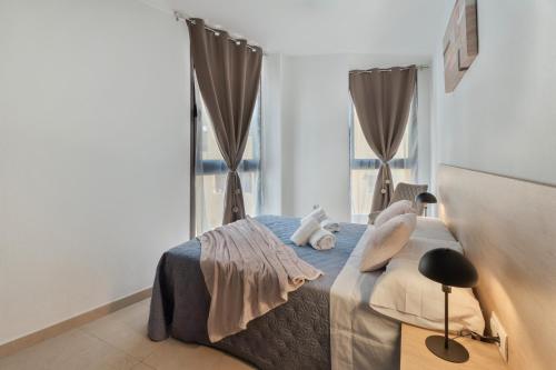 a bedroom with a bed with two pillows on it at Apartamento Estrella in Candelaria