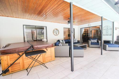 a view of a living room with a table at Elegant 3BR 2BA Private Pool Home in Palmetto