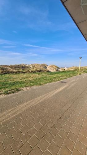 an empty road in the middle of the desert at SEA SIDE studio in Oostduinkerke