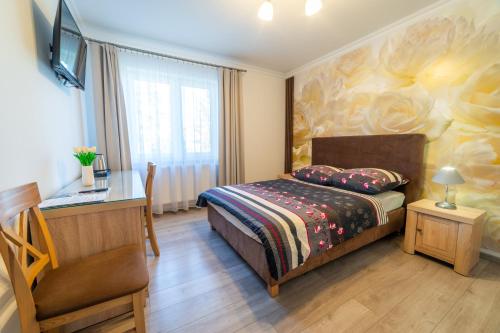 Posteľ alebo postele v izbe v ubytovaní Villa Mikołajki Popiełuszki 8