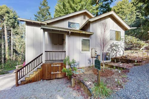 a small white house with a porch at Arcata Townhouse in Arcata