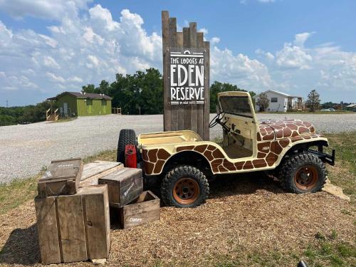 a jeep parked in front of a sign at Block of 4 Lodges at Eden Reserve - For Groups in Williamstown