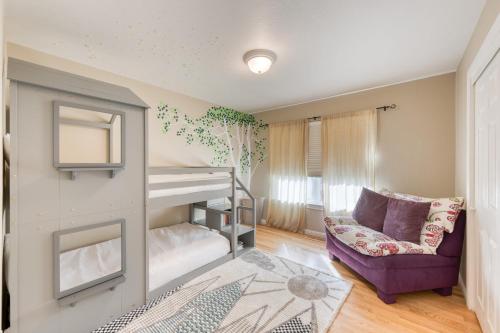 a bedroom with a bunk bed and a purple couch at Sonoma Hideaway w Private Pool Fire Pit Game Room Guest Studios in Sebastopol