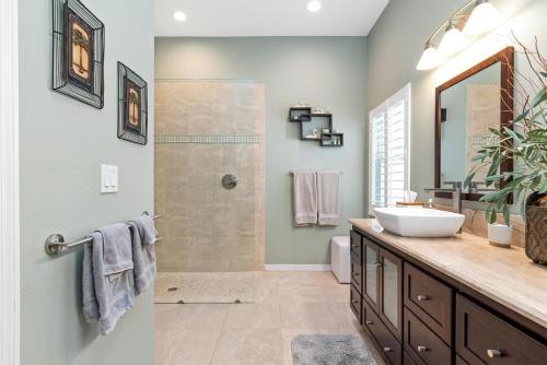 a bathroom with a sink and a shower at Tranquil 2BR lakefront home in Palmer Ranch in Sarasota