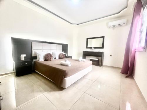 A bed or beds in a room at Anatoli deluxe house