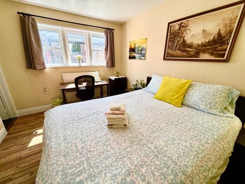 a bedroom with a large bed and a desk at Bright&Modern Space Perfect for couple and Family Step to public transit in Toronto in Toronto