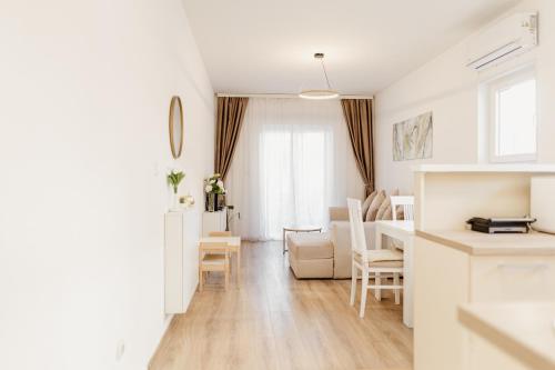 a kitchen and living room with a table and chairs at Andrea Lux in Kotor